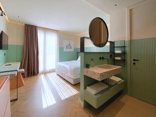 Postel nebo postele na pokoji v ubytování Iliria Boutique Hotel