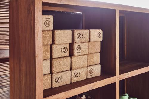 a stack of cork blocks sitting on a shelf at Outpost Ubud Penestanan in Ubud