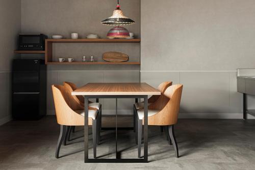 a dining room table and chairs in a kitchen at Hotel Aoka Kamigoto in Shinkamigoto