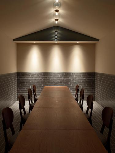 a conference room with a long table and chairs at Hotel Aoka Kamigoto in Shinkamigoto