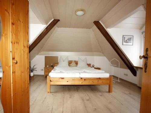 a bedroom with a bed in a attic at Altes Forsthaus in Bad Peterstal-Griesbach