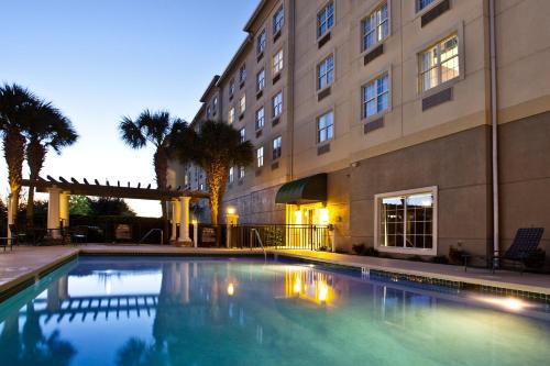 a swimming pool in front of a building at EVEN Hotels Sarasota-Lakewood Ranch by IHG in Sarasota
