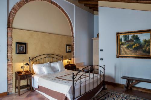 Giường trong phòng chung tại Antico Casale L'impostino
