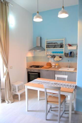 a kitchen with a table and a stove at Maridea - Ponza low cost in Ponza