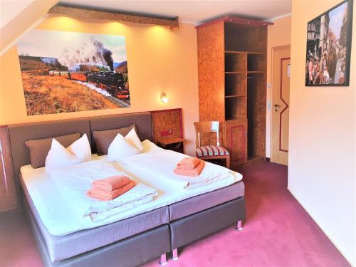 Giường trong phòng chung tại Apart Hotel Wernigerode