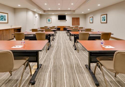 a classroom with tables and chairs and a podium at Staybridge Suites - Oklahoma City - Downtown by IHG in Oklahoma City