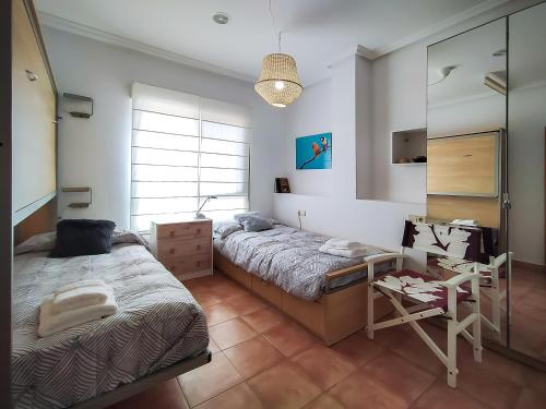 En eller flere senge i et værelse på Apartamento con 129m2 de Terraza con vistas
