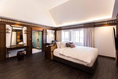 Una cama o camas en una habitación de Nine Hotel Chiangmai
