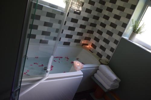 a bathroom with a shower with a bath tub at Healing Pastures Farm in Llanbrynmair