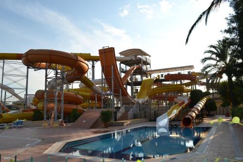a water park with a water slide and a pool at AQI Pegasos World in Side