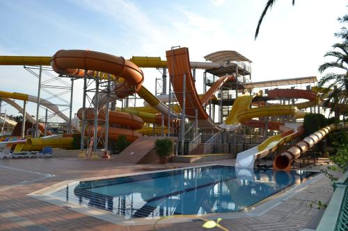 a water park with a water slide and a pool at AQI Pegasos World in Side