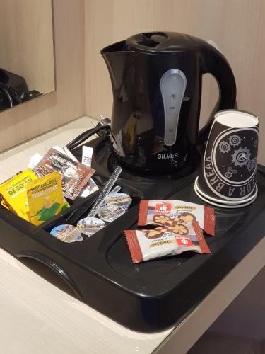 a black tray with a tea pot on a counter at Abelonas Village in Megalokhori
