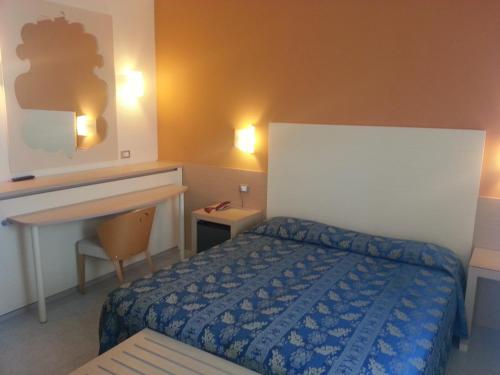 Posteľ alebo postele v izbe v ubytovaní Hotel Duca Degli Abruzzi