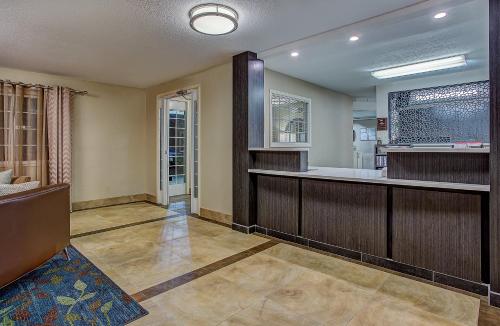 a room with a bar with a tub in it at Candlewood Suites Louisville Airport by IHG in Louisville