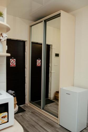 a glass door in a room with signs on it at Apartments at Kontorska 10 in Kharkiv