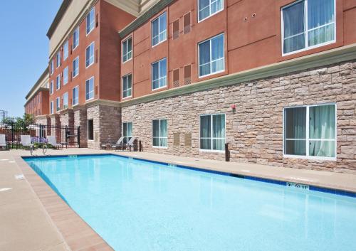 a large swimming pool in front of a building at Holiday Inn Oakland Airport, an IHG Hotel in Oakland