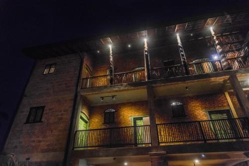 a building with a balcony with lights on it at Negombo Boutique Villa in Negombo