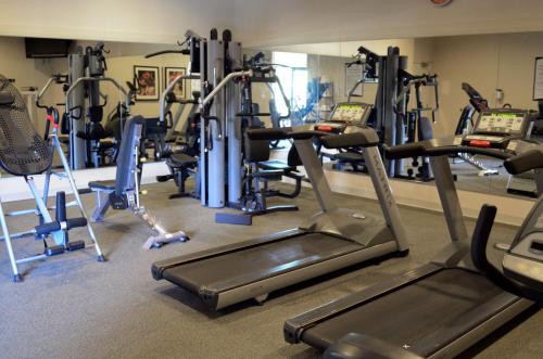 a gym with several tread machines in a room at Staybridge Suites San Antonio Sea World by IHG in San Antonio