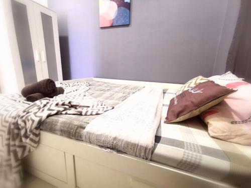 a bedroom with a bed with a white frame at CoZy Suite @ PJ & Sunway(2 Bedroom) in Petaling Jaya
