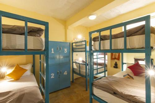 a room with blue bunk beds in a room at Hotel Golden City with Swimming Pool in Jaisalmer