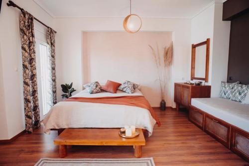 a bedroom with a bed and a coffee table at Sealake View in Mesolongion