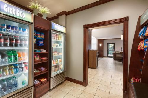 a store with an open refrigerator with drinks at Staybridge Suites Tampa East- Brandon by IHG in Tampa