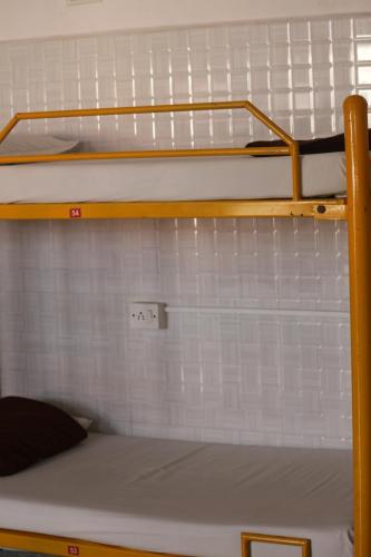 a couple of bunk beds in a room at vrs dormitary in Mysore