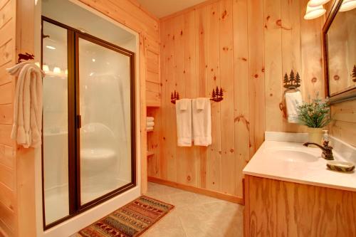 a bathroom with a shower and a sink at Serenity Woods in Pleasant Hill