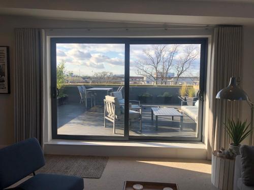a window in a living room with a view of a patio at Chapel Penthouse in York