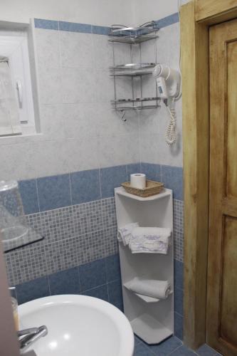 a bathroom with a sink and a toilet in it at Antica Dimora in Monteroni dʼArbia
