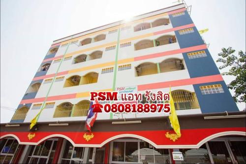a building with a sign on the front of it at PSM AT RANGSIT in Ban Bang Khan