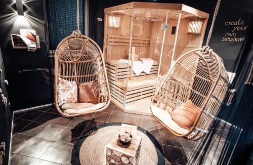 a room with three birds cages and a table at Holiday Home Wonderland with private Spa/Wellness in Ralingen