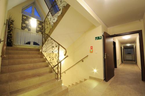 a staircase in a building with a stair case at Sykowny Biały Dunajec in Zakopane