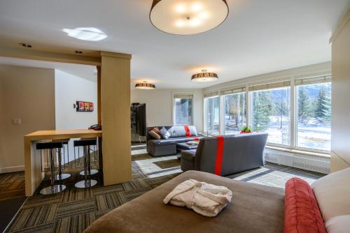 a living room with a couch and a table at Bow View Lodge in Banff