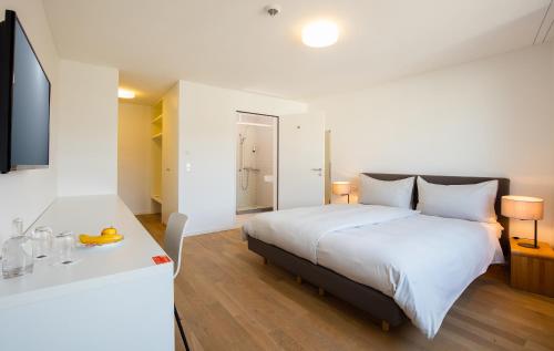 Ein Bett oder Betten in einem Zimmer der Unterkunft Motel Rheinfels Park