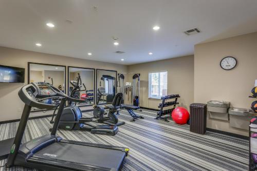 a fitness room with treadmills and elliptical machines at Candlewood Suites College Station by IHG in Bryan