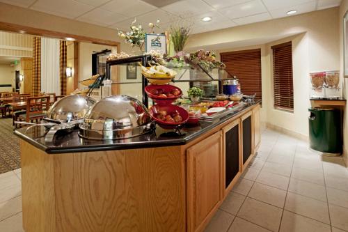 a kitchen with a counter with food on it at Staybridge Suites - Brownsville by IHG in Brownsville