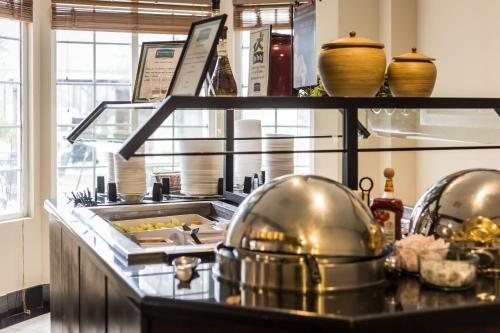 a kitchen with a buffet of food on a counter at Staybridge Suites Austin Airport by IHG in Austin