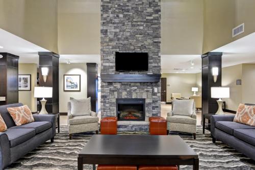 a lobby with couches and a fireplace at Staybridge Suites Mt Juliet - Nashville Area in Mount Juliet