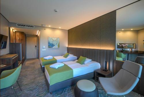 Postel nebo postele na pokoji v ubytování Hunguest Hotel Sóstó