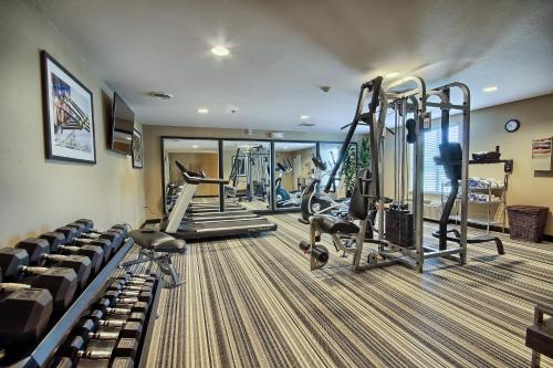 a gym with several treadmills and tread machines at Candlewood Suites Columbus - Grove City by IHG in Grove City