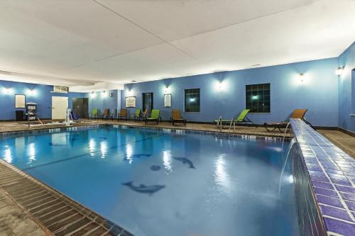 a large swimming pool with blue water at Staybridge Suites Amarillo Western Crossing by IHG in Amarillo