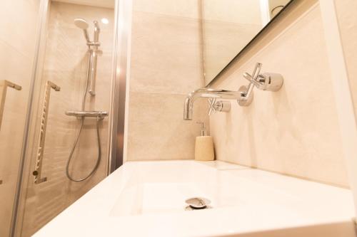 a bathroom with a shower and a sink at Appartement Schin op Geul in Schin op Geul
