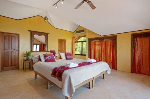 a bedroom with a large bed in a room at Anamaya Resort in Montezuma