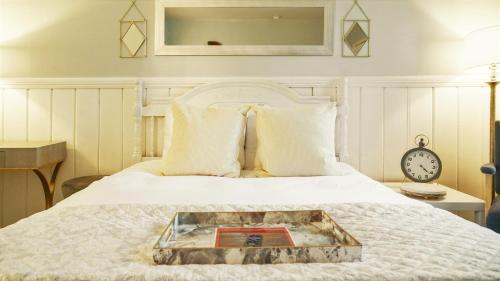 a bed with a tray on top of it at Playpark Lodge in South Lake Tahoe