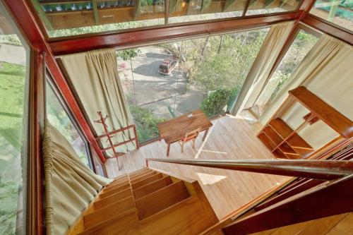 an overhead view of a staircase in a tree house at Anamaya Resort in Montezuma