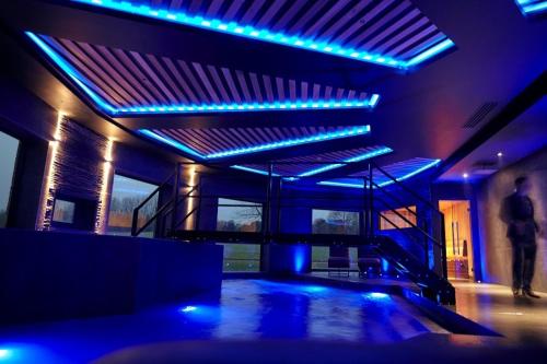 a room with blue lights in a building at Cave Hotel & Golf Resort in Faversham