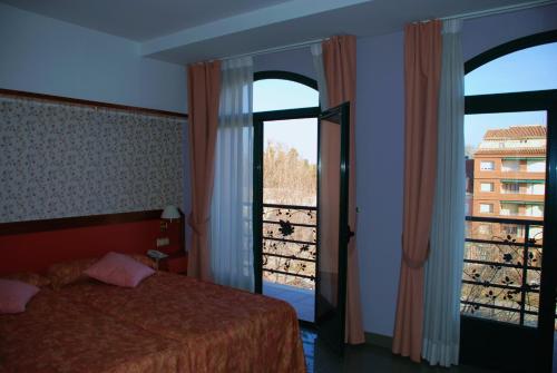 Ένα ή περισσότερα κρεβάτια σε δωμάτιο στο Hotel Jardín de Aranjuez