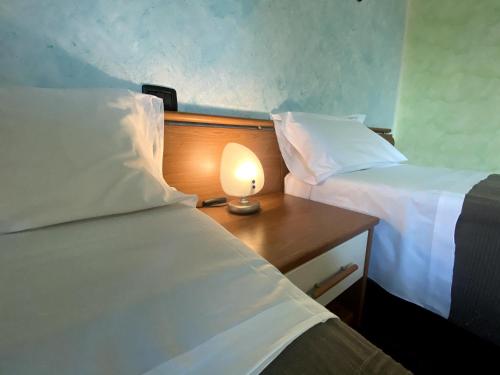 Ein Bett oder Betten in einem Zimmer der Unterkunft Sole della Franciacorta - Hotel & Restaurant
