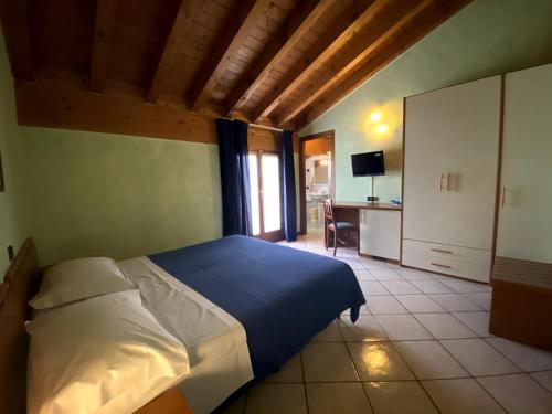 Ein Bett oder Betten in einem Zimmer der Unterkunft Sole della Franciacorta - Hotel & Restaurant